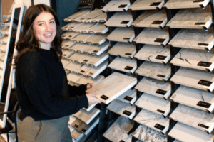 Neil Kelly designer looking at countertop samples.