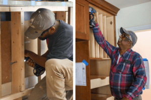 Carpenters putting together new cabinets.