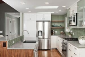 Kitchen island with a kitchen sink in the middle.