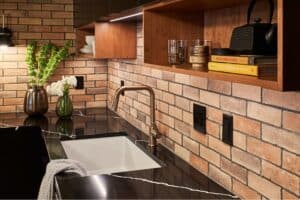 Undermount kitchen sink in a black granite countertop.